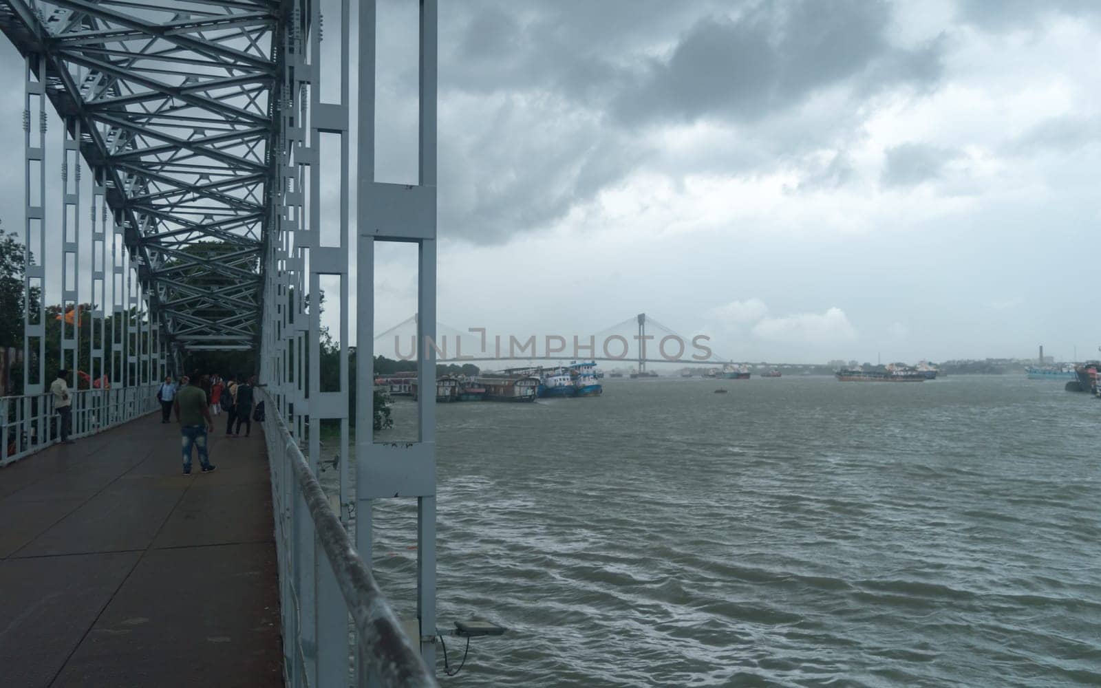 Kolkata Riverside Landscape View on a Dark cloudy day. View from Babu Ghat Footbridge. Kolkata West Bengal India South Asia 19 June 2022