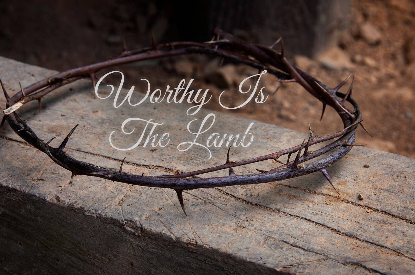 Christian prayer text - Worthy Is The Lamb. With crown of thorns on old wood background. Christianity concept.
