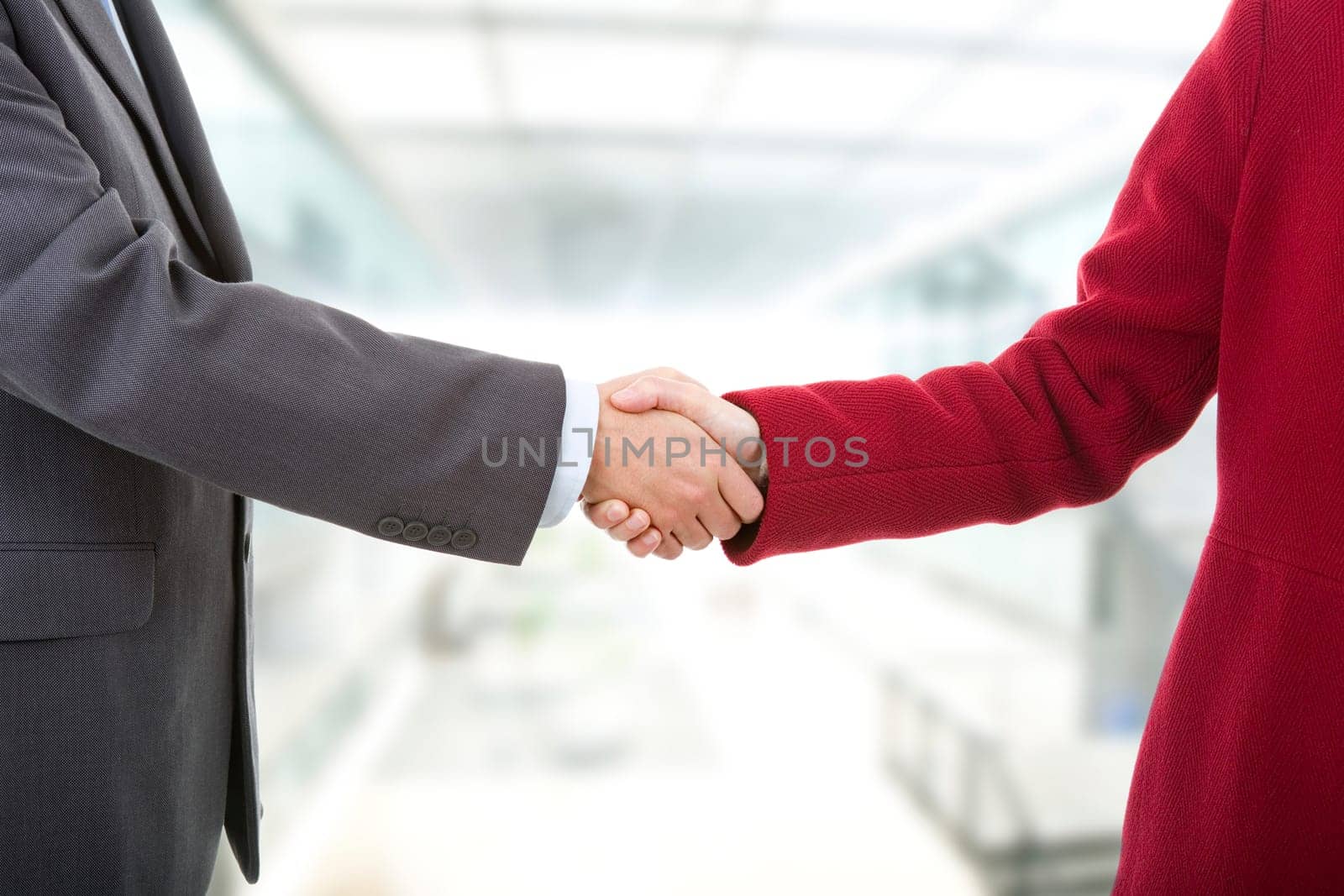 business couple shaking hands at the office