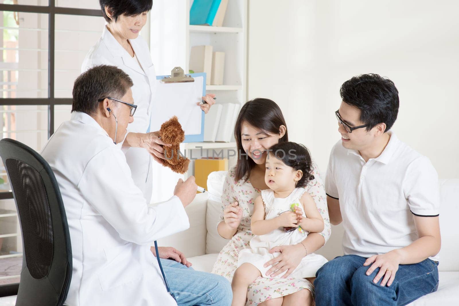 Family doctor vaccines or injection to baby girl. Pediatrician and patient.