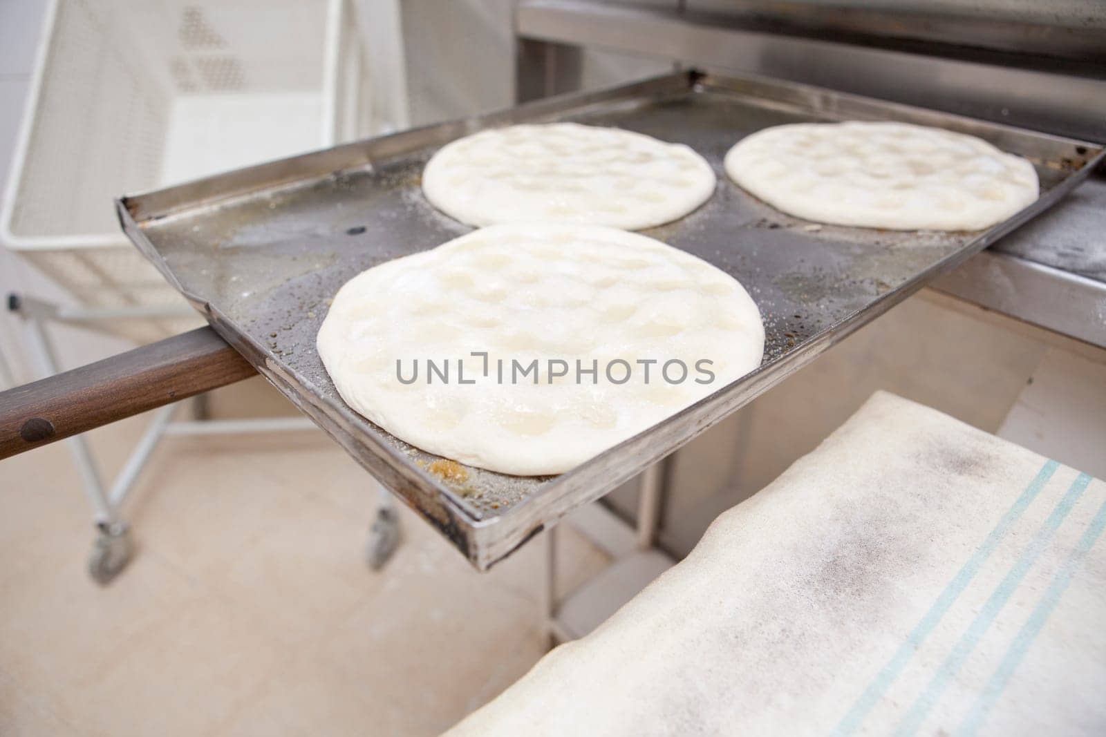 Elaboration process of traditional spanish olive oil pancakes. Pancakes ready for baking