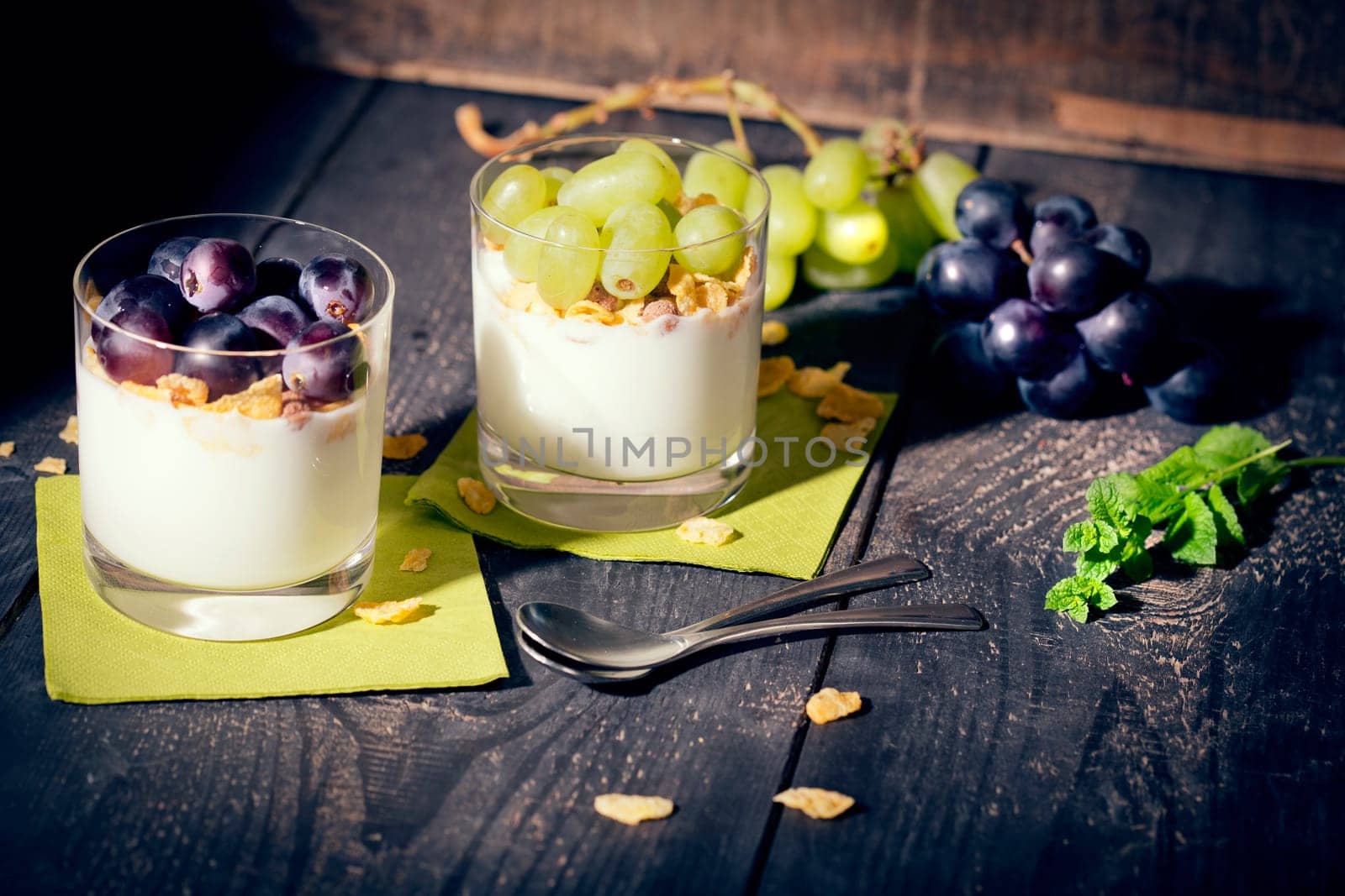 Lean yoghurt with cornflakes and grapes,fresh mint,studio