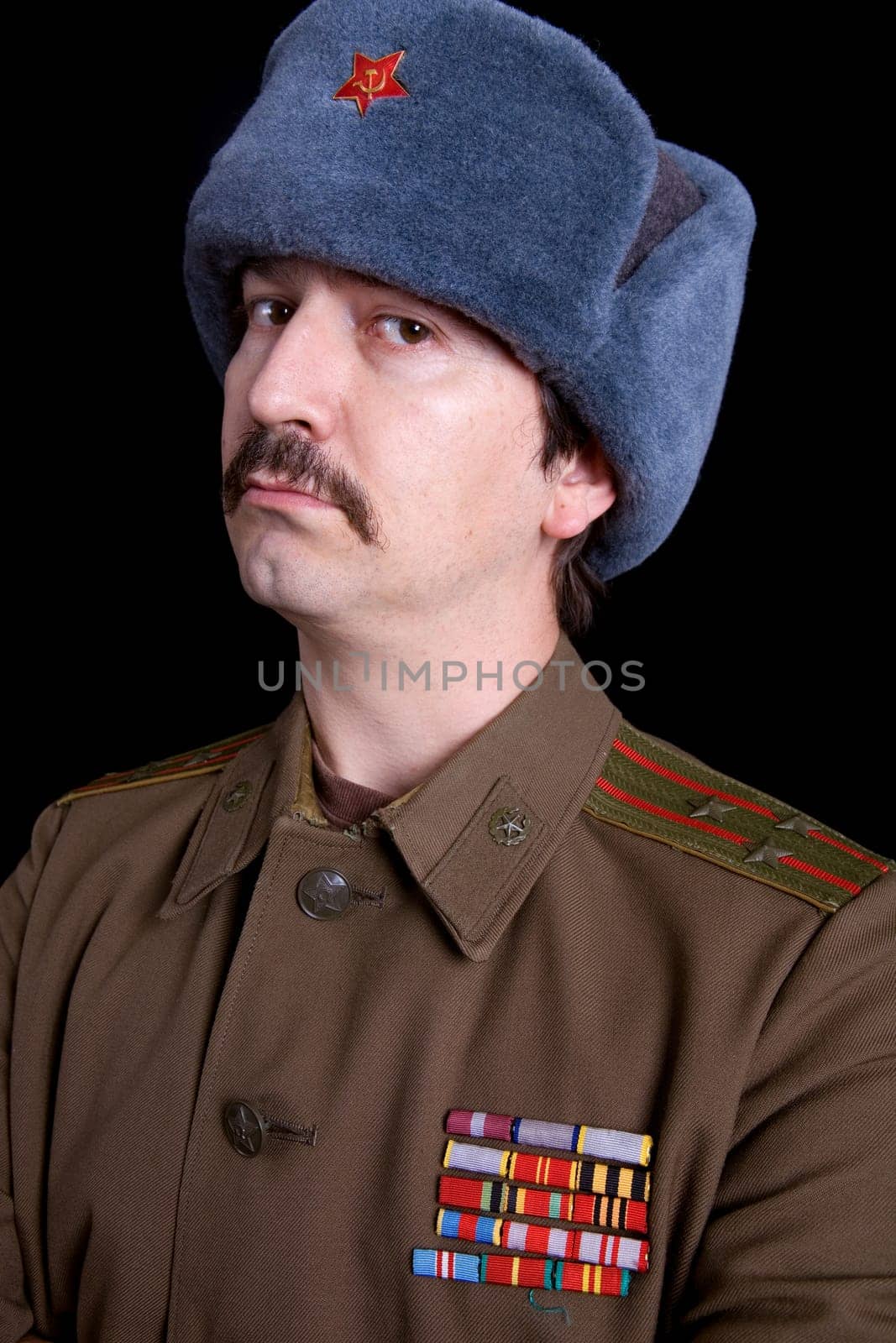 young man dressed as russian military, studio