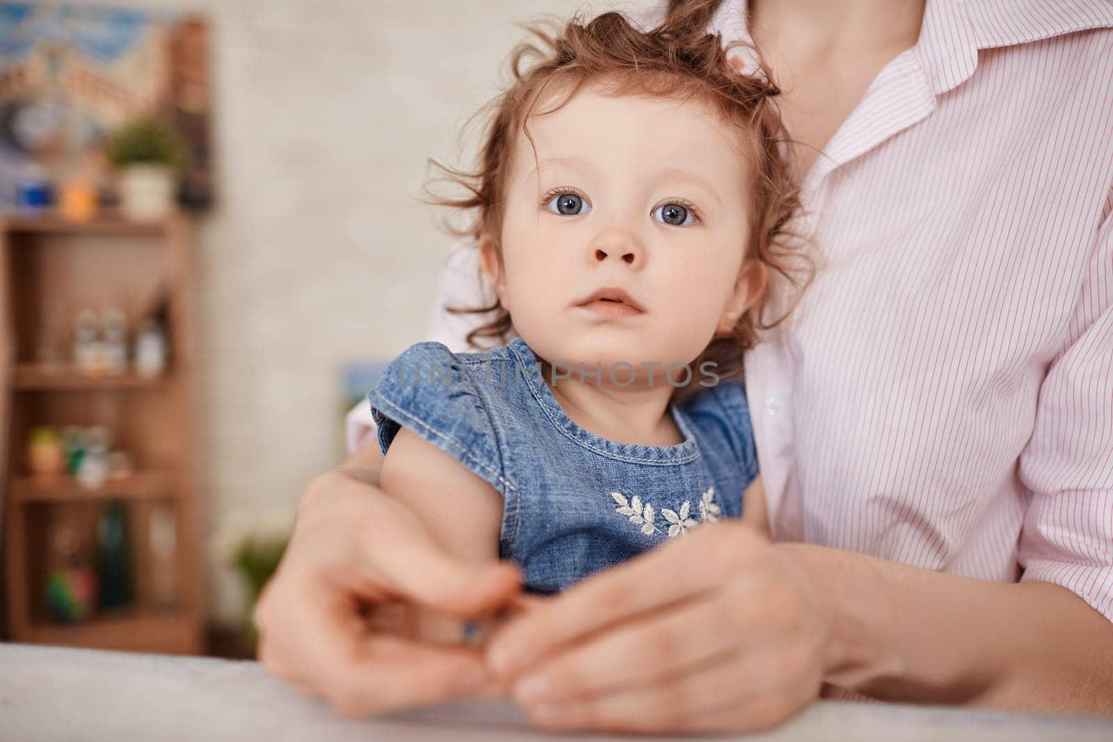 Sweet girl in her mother arms