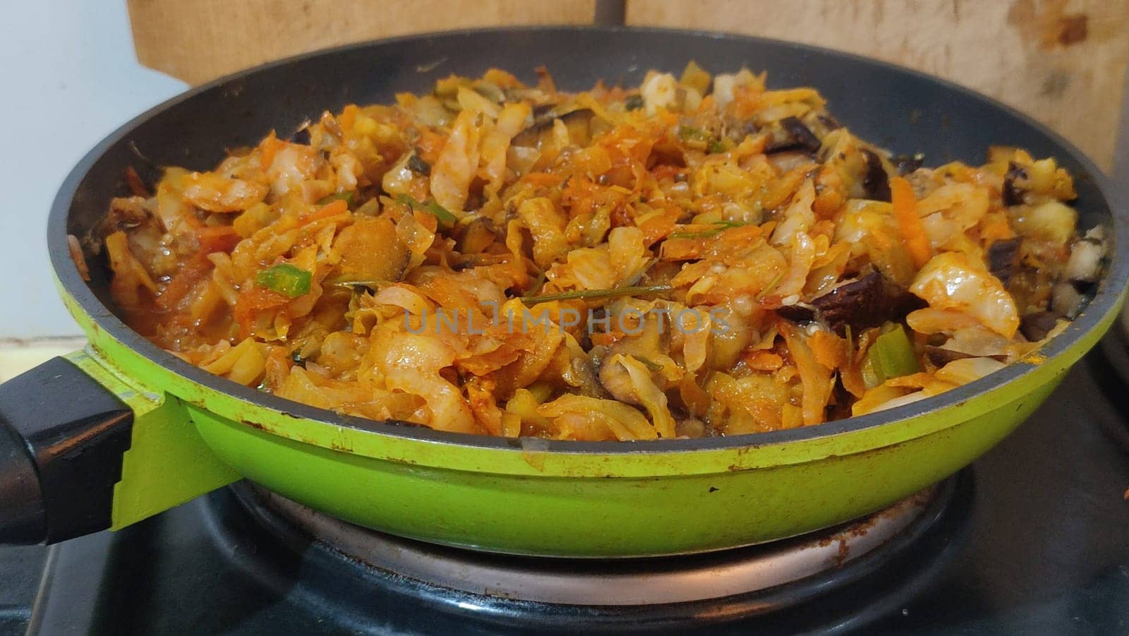 meat vegetables stewed onion frying pan healthy food meat vegetables stewed onion frying pan home cooking stove cooking recipe dish dinner lunch delicious, horizontal format photo. High quality photo
