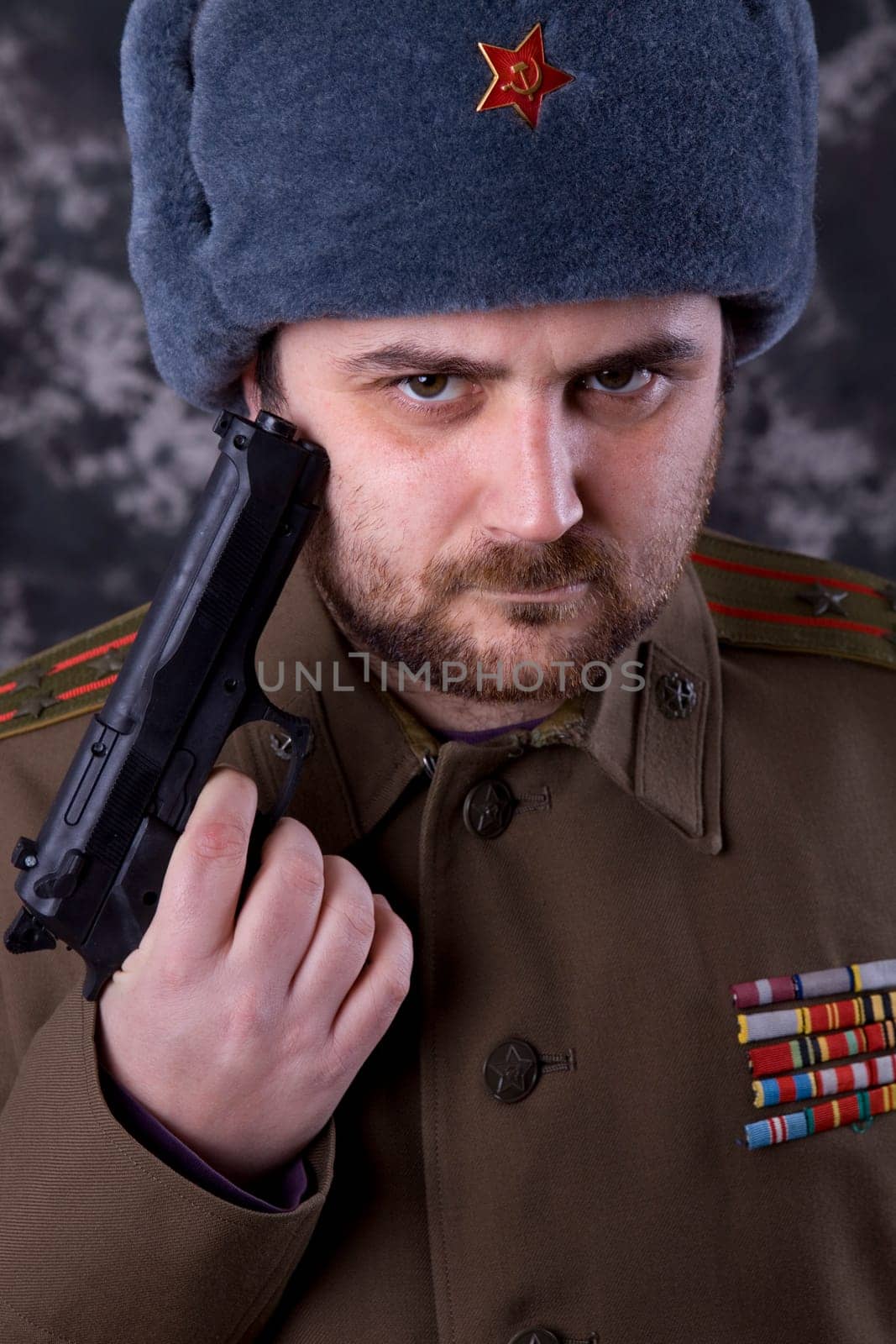 young man dressed as russian military, studio