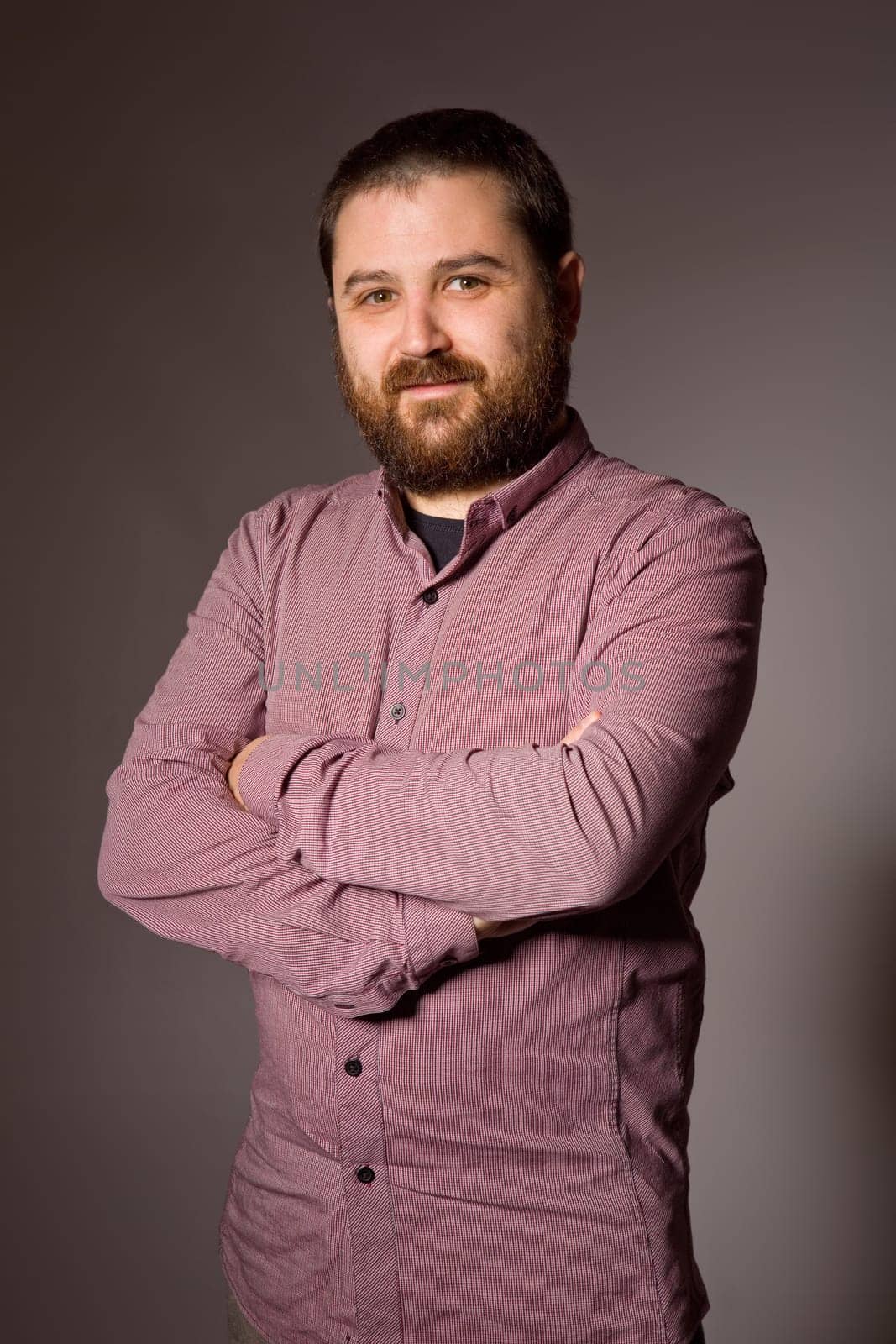 young casual man portrait in a dark background