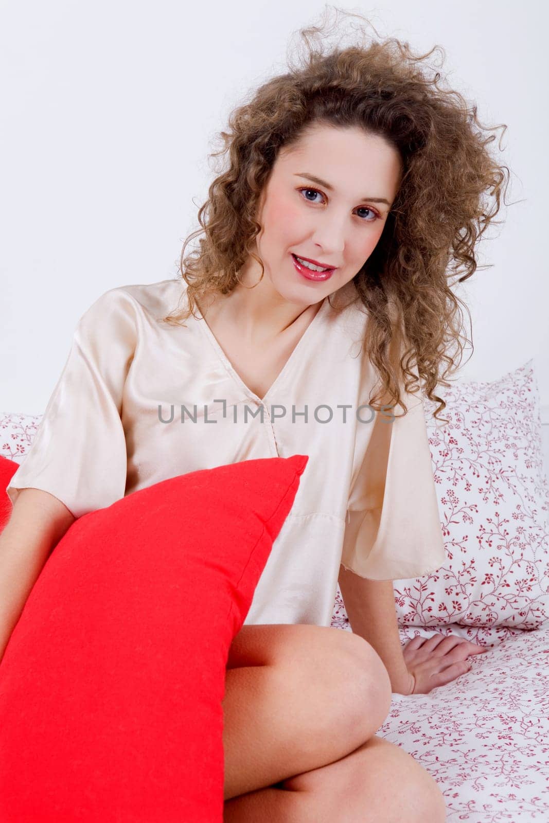 an young beautiful sensual woman in bed