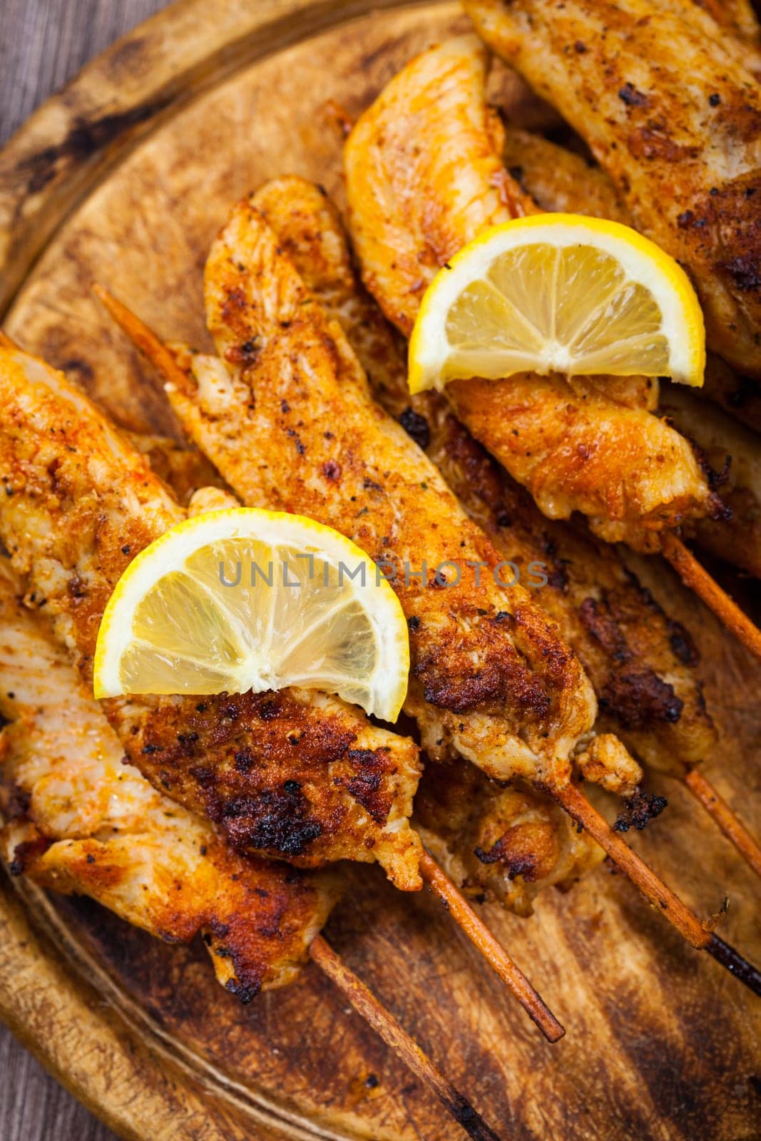 Grilled chicken skewers with lemon marinade