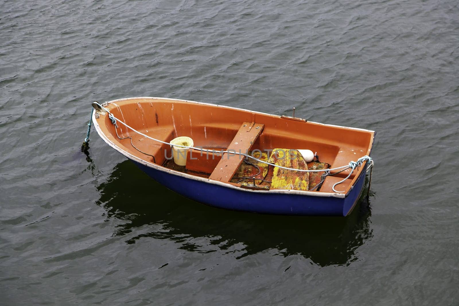 Detail of old fishing boat in the sea, abandoned