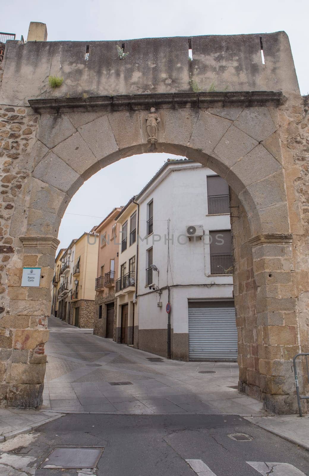 Coria Gate at Medieval street at Plasencia Old town, Caceres, Extremadura, Spain