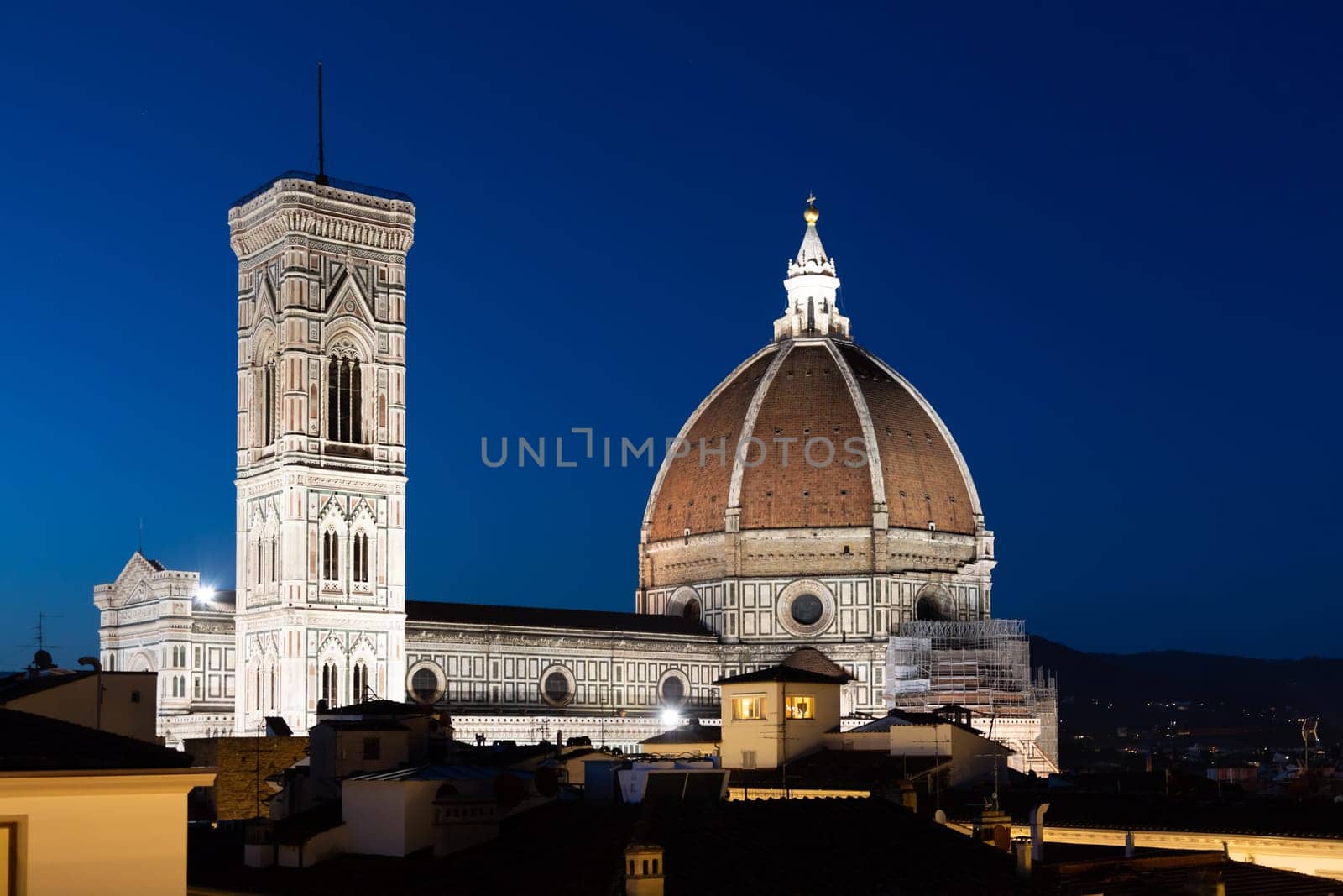 Florence Duomo and Campanile - Bell Tower - architecture illuminated by night, Italy. Urban scene in exterior - nobody