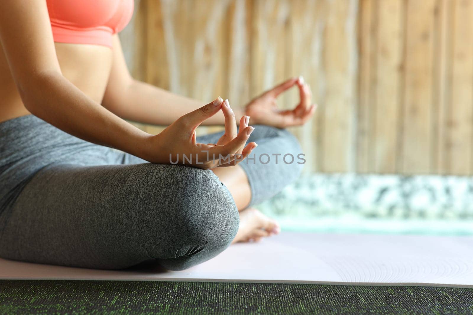 Close up of a yogi hands doing yoga meditation exercise in spa