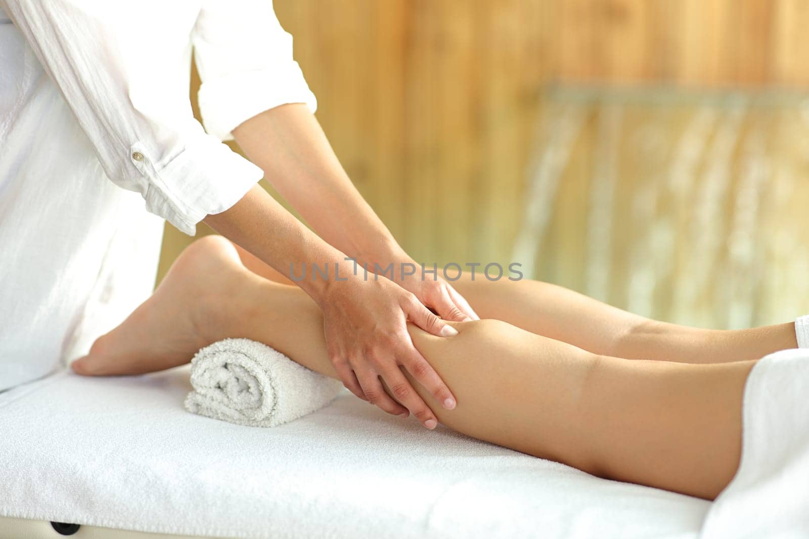 Close up portrait of a woman legs receiving a massage in spa