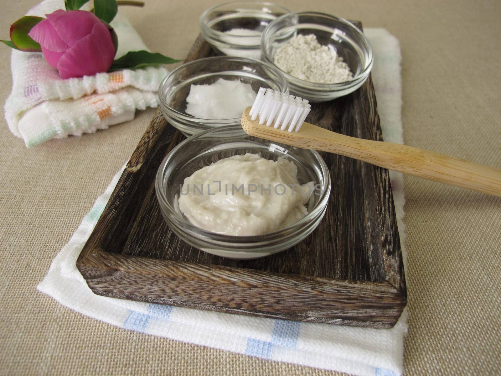 Homemade toothpaste from three ingredients with coconut oil, xylitol and chalk powder