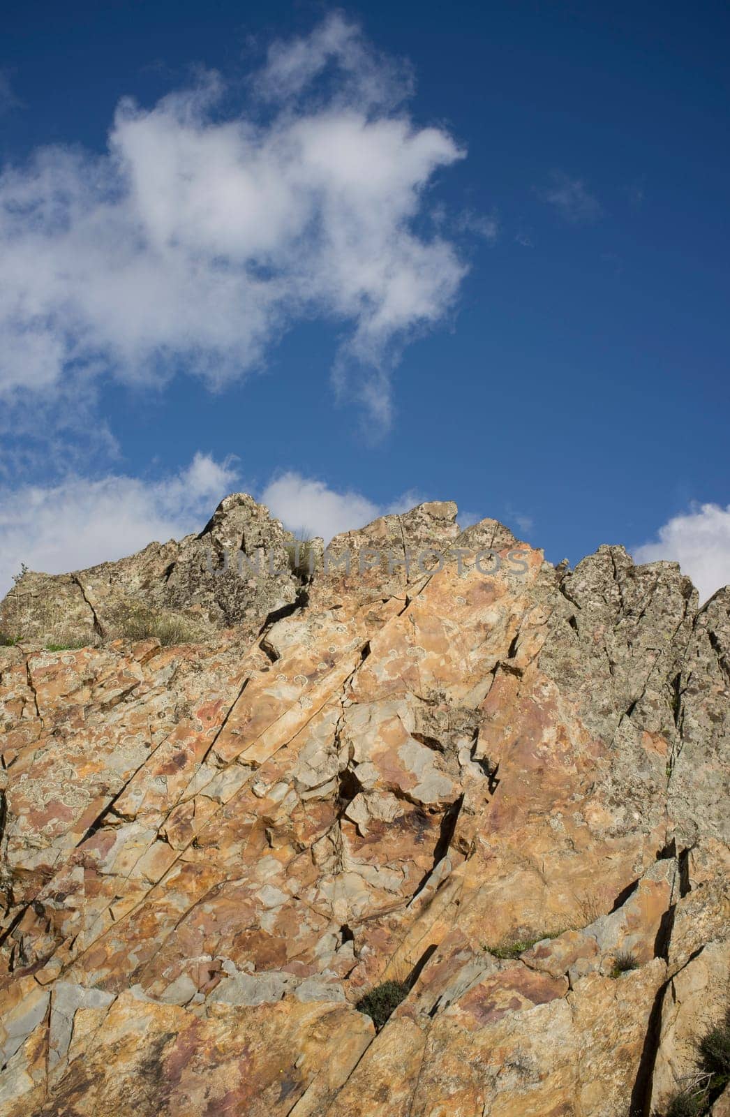 Peaks topped by quartzite rocks at Sierra de la Mosca, Caceres, Spain. Entire crest view