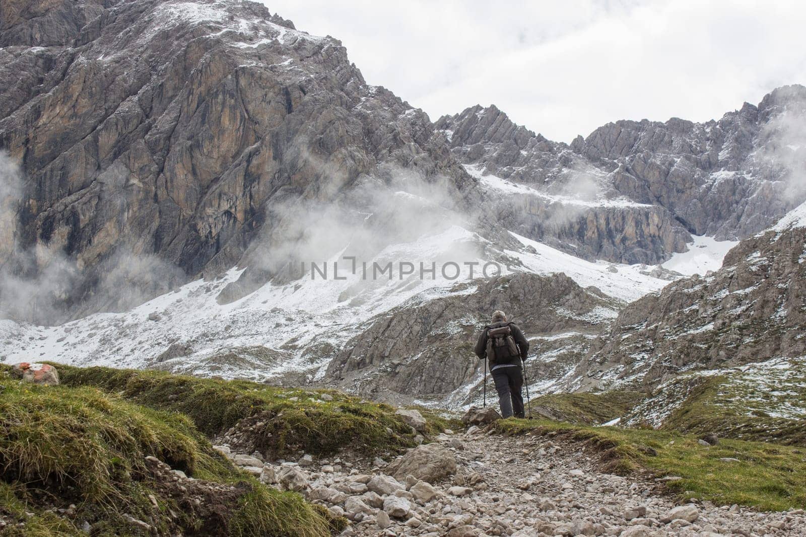 man trekking in the mountains, Alps in Austria, Lienzer Dolomiten, East Tyrol
