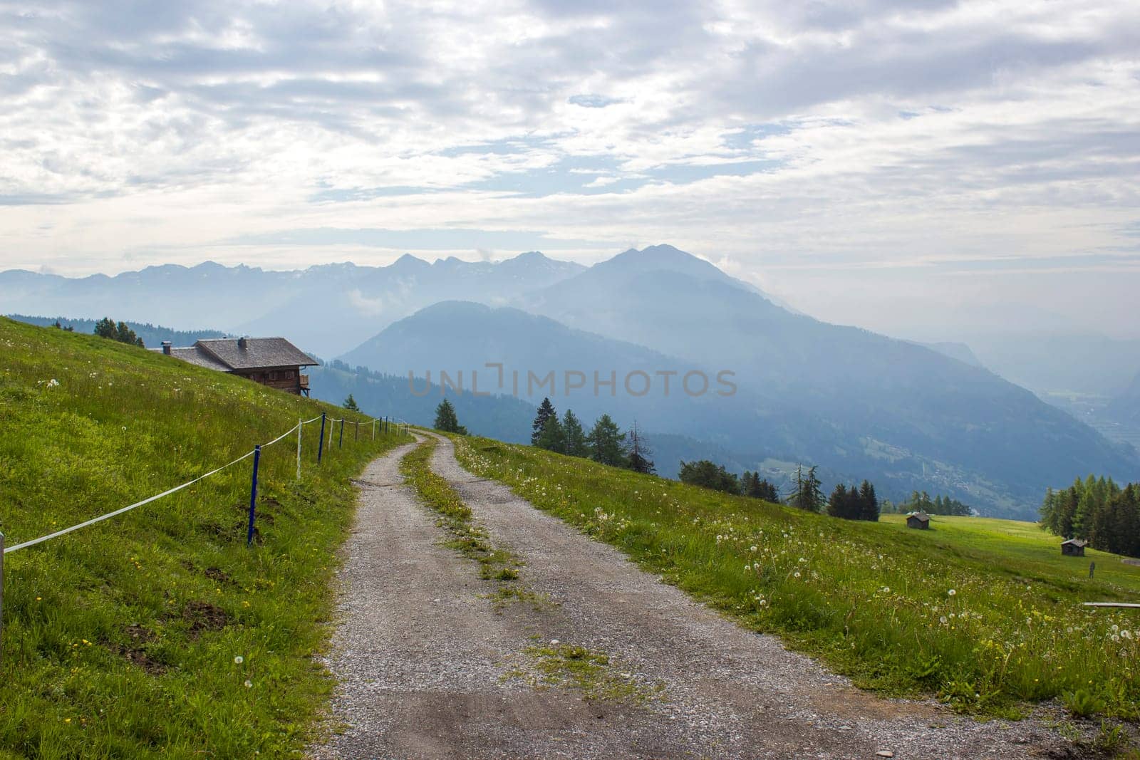Landscape of Lienz Dolomites in Austria. Road and panorama of massive Alpine mountains. East Tyrol