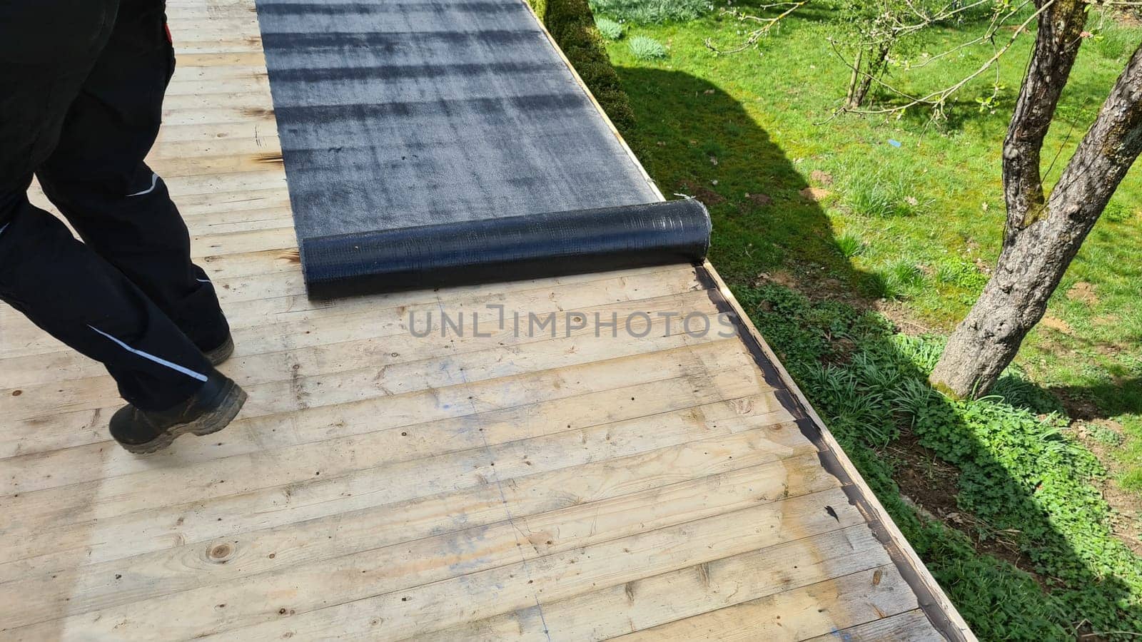 Roofing felt welding on bitumen roof roof repair with roofing felt and open flame propane tool on flat roof, leak with free space for text