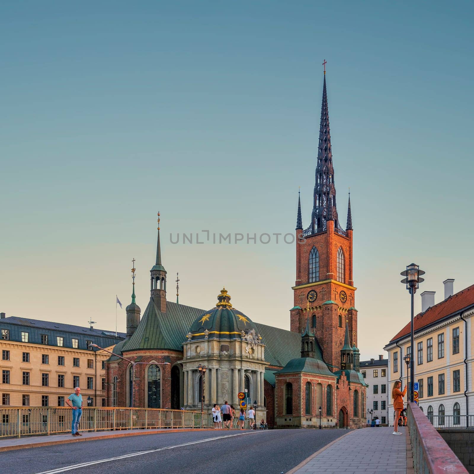 Stockholm, Sweden - June 25 2022: Riddarholmen Church, located in the island of Riddarholmshamnen, old city, Gamla stan. View from Riddarholmsbron bridge before sunset in a summer day