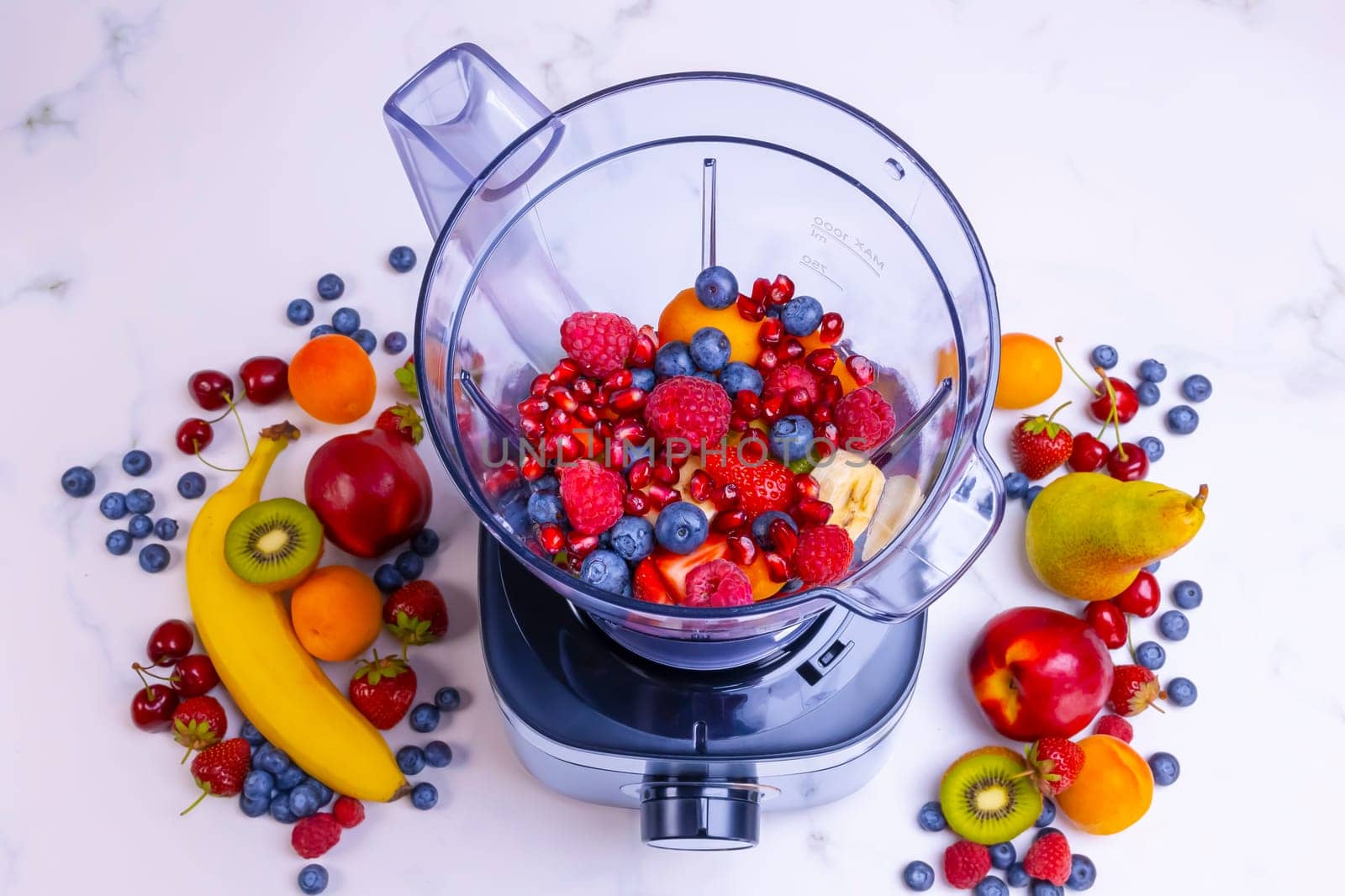 Fresh fruit smoothie in blender. Preparing a fresh drink full of vitamins for a healthy diet.