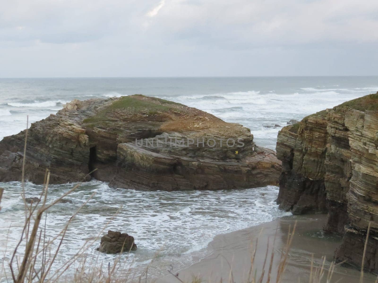 Beautiful beach of the cathedrals with the sea very finely chopped many waves and large