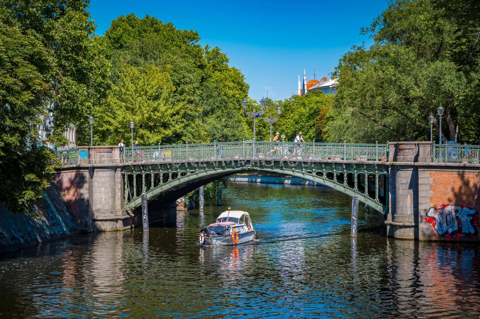 Berlin, Germany, June 2022: View on the Admiralbrucke bridge over the Landwehr canal on the border of Neukolln and Kreuzberg in Berlin