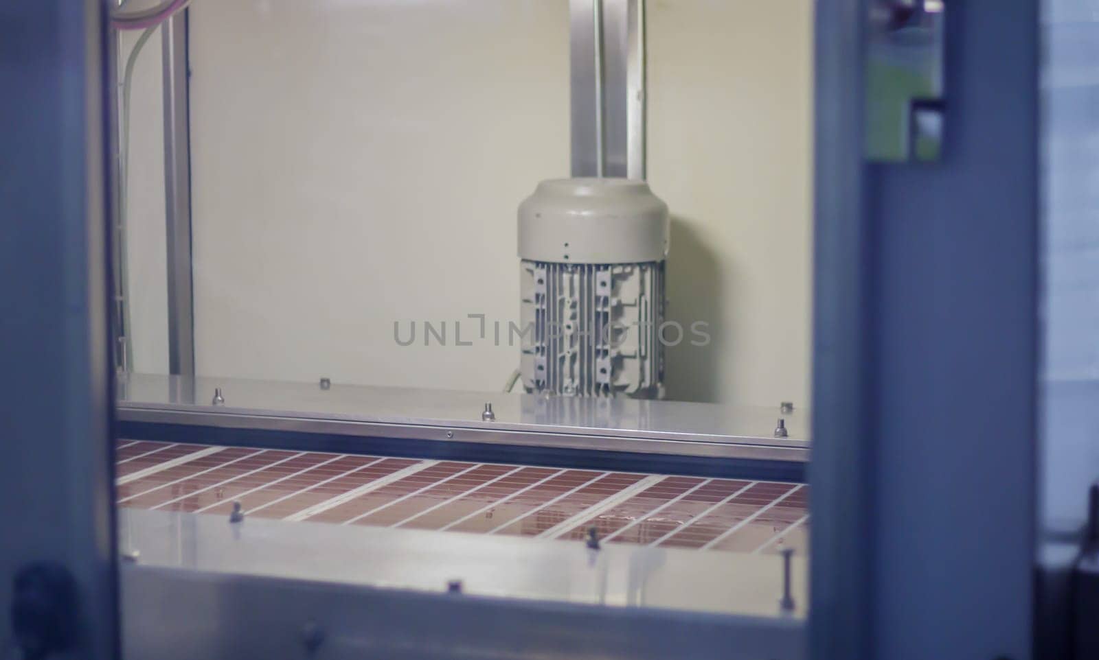 Line for the production of chocolate in an industrial factory. Automatic process in the production line of sweets. Images from the chocolate factory during production. Conveyor belt with sweets
