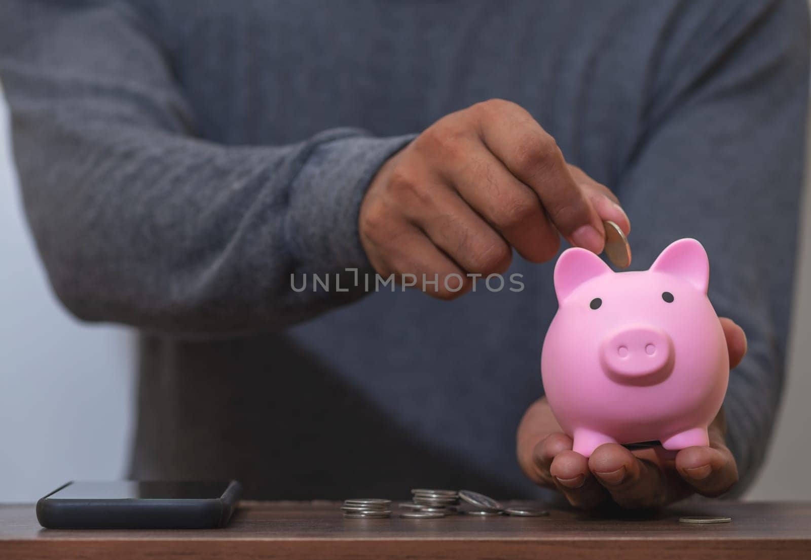 Save money and account banking for finance concept, Piggy bank with coin on blurred background, Save Monney for Investors Using Internet to Trade Stocks or Trade Fund