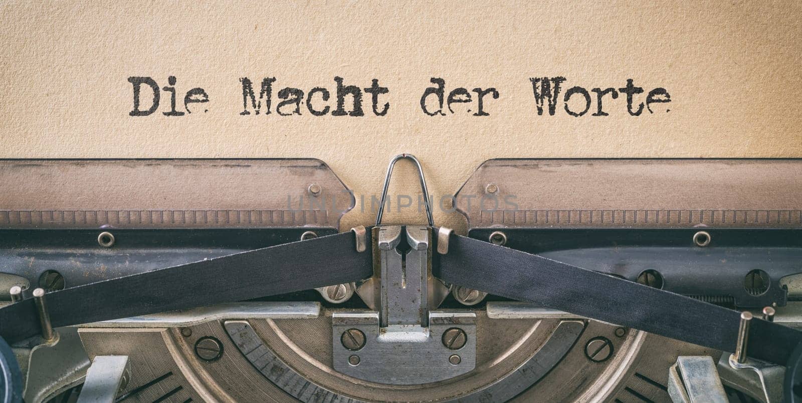 Text written with a vintage typewriter - The power of words in german - Die Macht der Worte