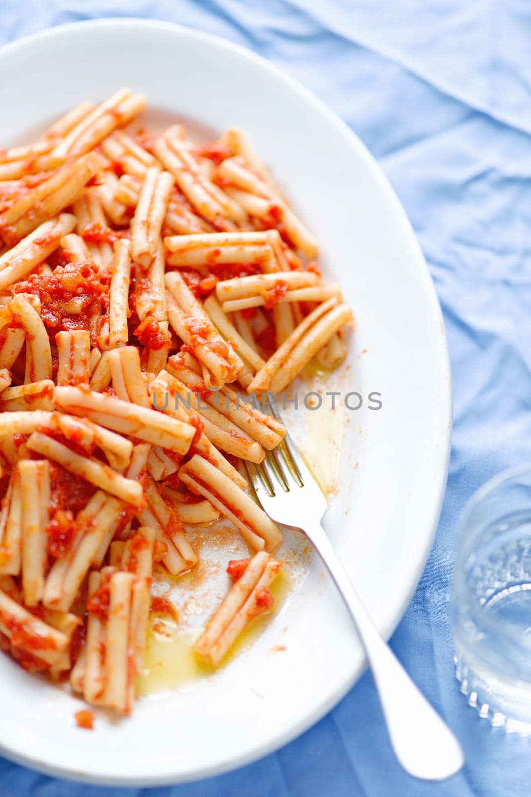 close up of italian pasta in tomato sauce