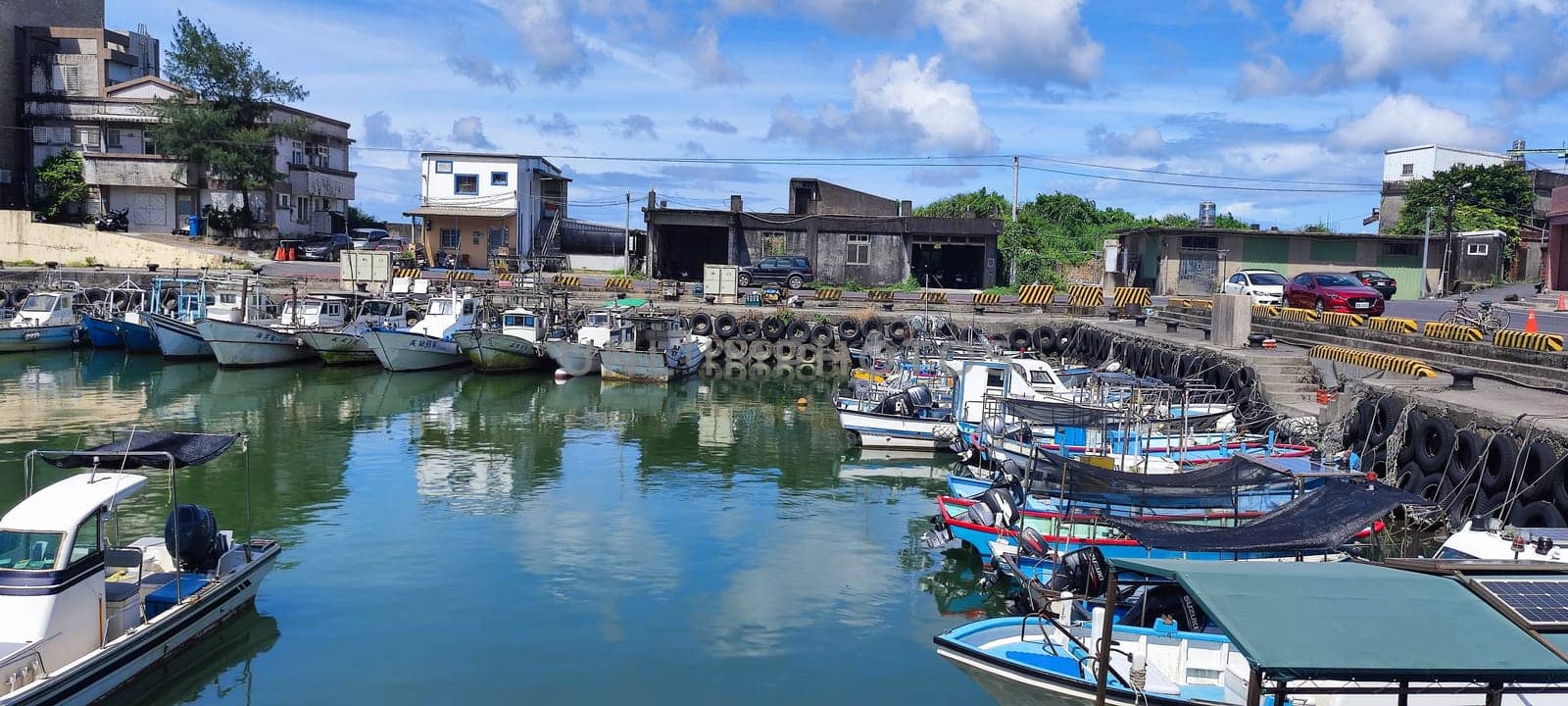 Gongliao Fishing Port, New Taipei City - Jul 27, 2022 : Located in Gongliao District and Miri Longdong Bay, surrounded by mountains on three sides and only facing the sea in the northeast to form a natural small bay, New Taipei City, Taiwan