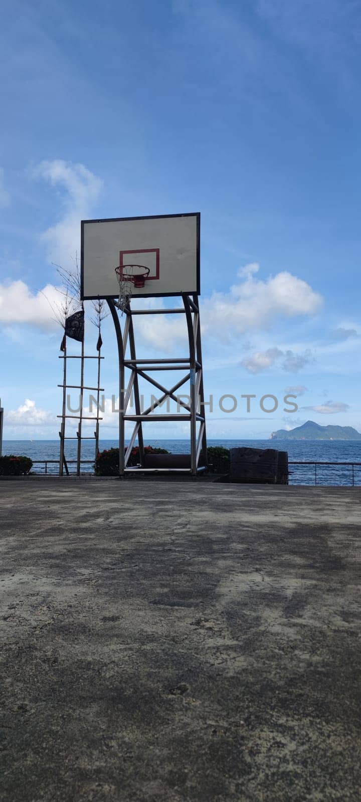 Daxi Daan Temple front basketball court, Yilan County - Jul 27, 2022 : Daxi Daan Temple front basketball court! Sitting on the dreamy sea view of Guishan Island, Yilan County, Taiwan