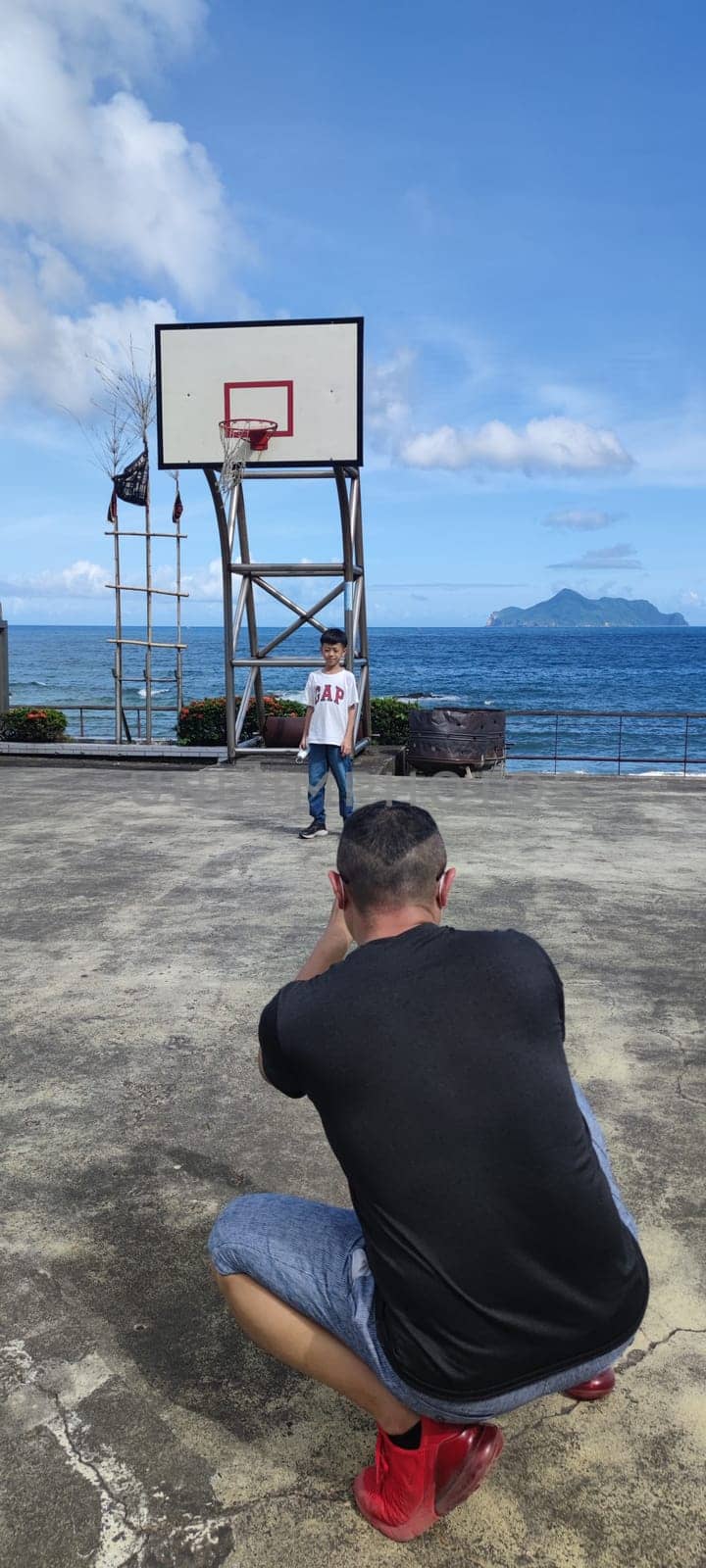 Daxi Daan Temple front basketball court, Yilan County - Jul 27, 2022 : Daxi Daan Temple front basketball court! Sitting on the dreamy sea view of Guishan Island, Yilan County, Taiwan