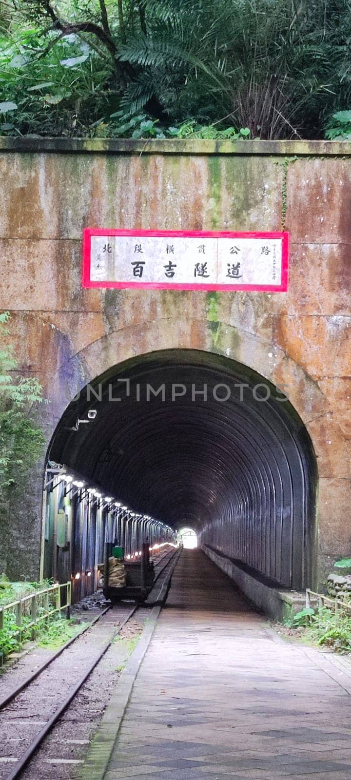 Baiji Tunnel, Taoyuan City - Jul 27, 2022 : Originally part of the north section of the cross-Taiwan No. 7 highway, the Japanese opened a special tunnel for pedestrians, air defense and evacuation in 1944, Taoyuan City, Taiwan