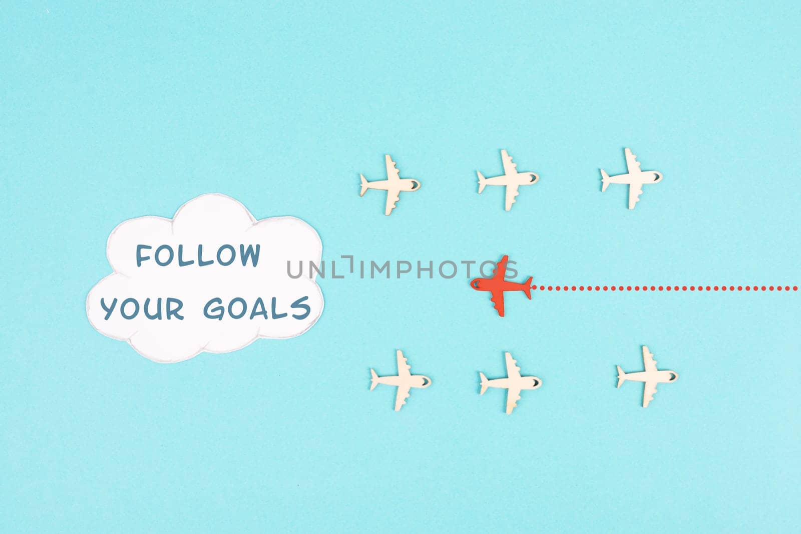 Red airplane is following his goal, leadership, courage and winner concept, standing out from the crowd, positive mindset for success in business