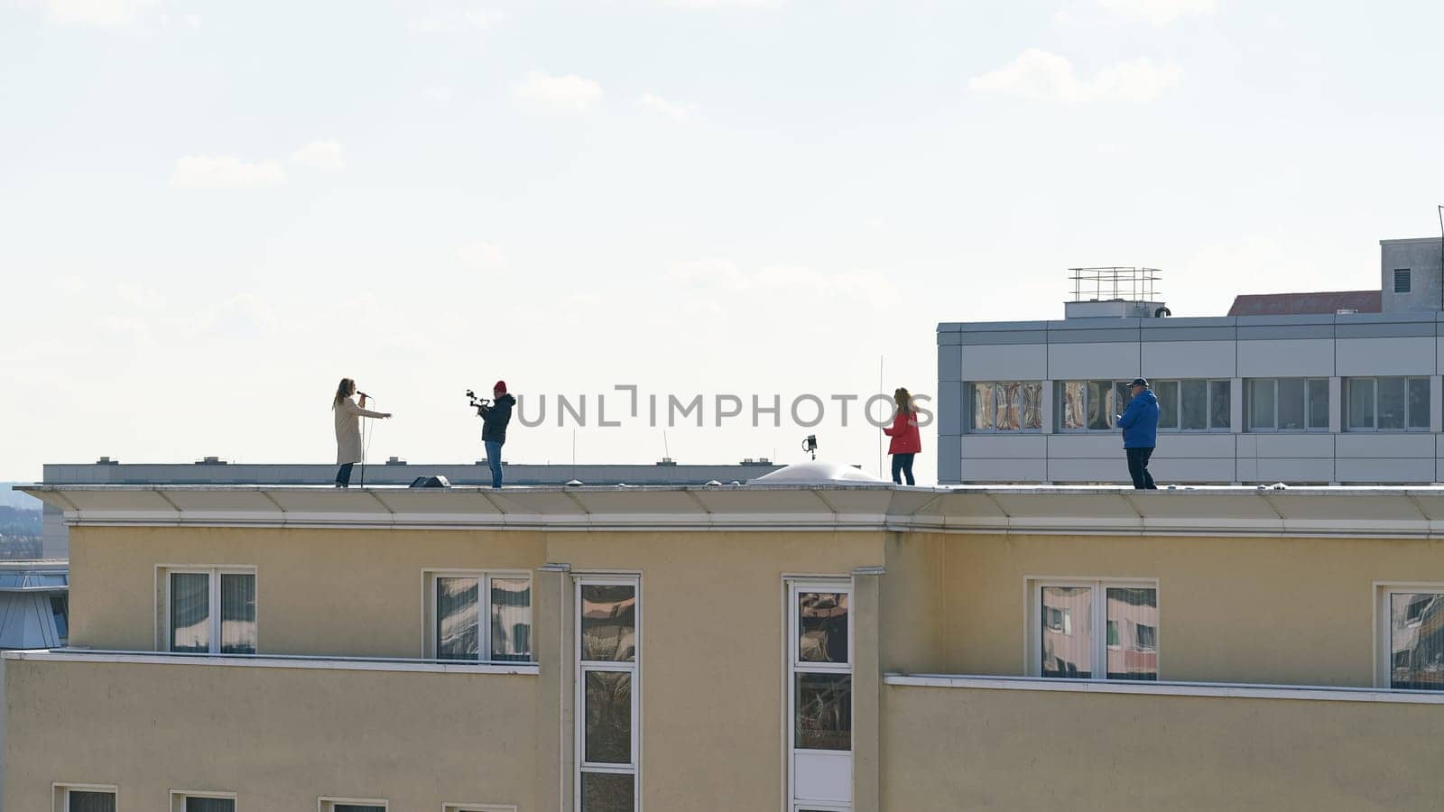 Production of a music video on the roof of a house in the city center of Magdeburg in Germany