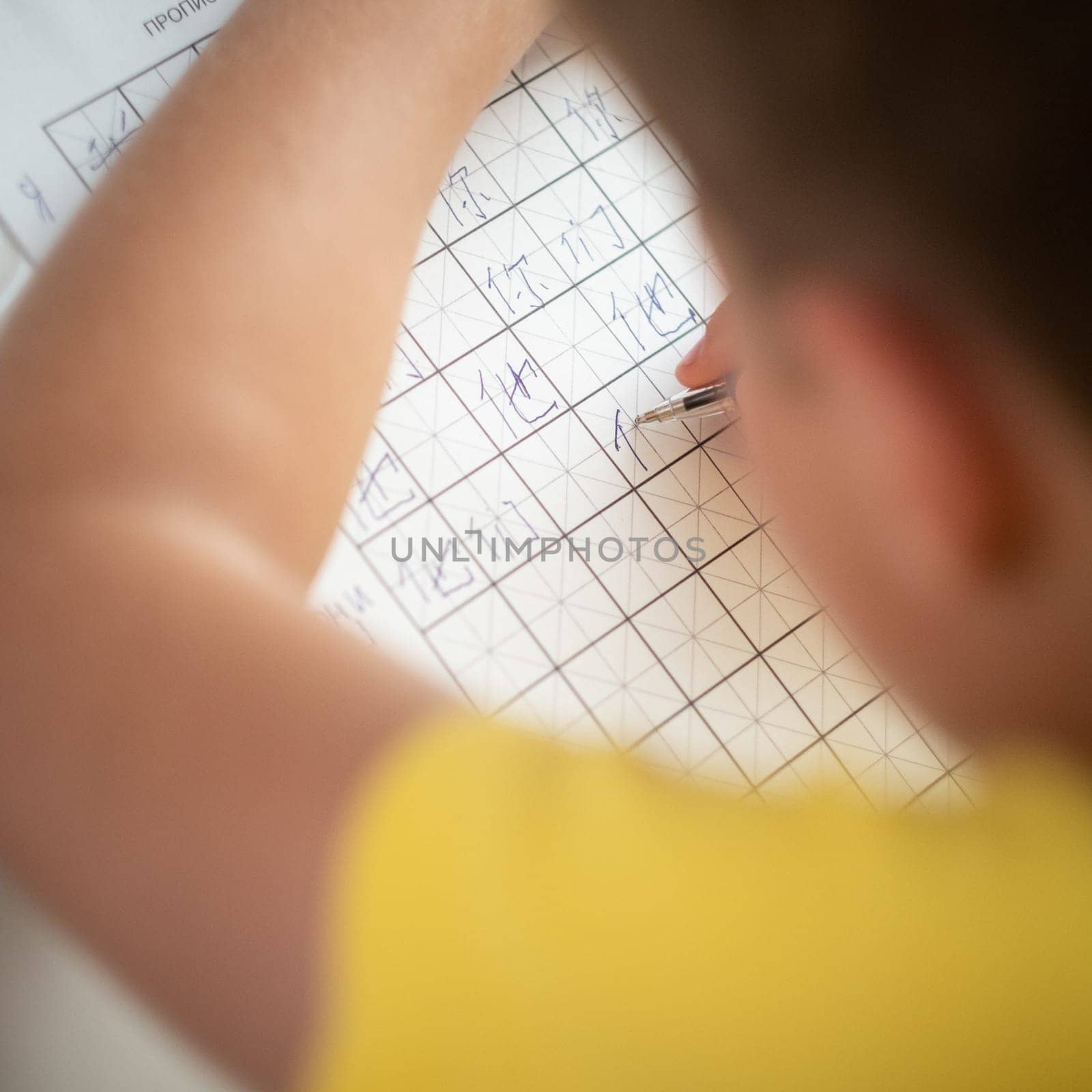 Boy learns chinese langruage and hieroglyphs editorial