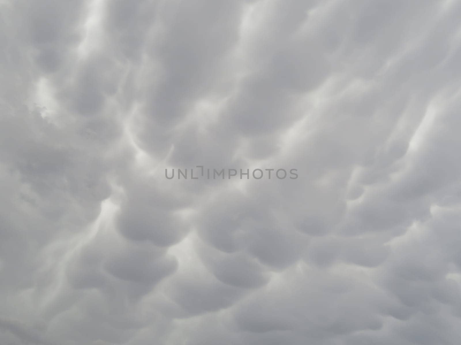 beautiful gray storm clouds arranged to rain water with wavy shapes