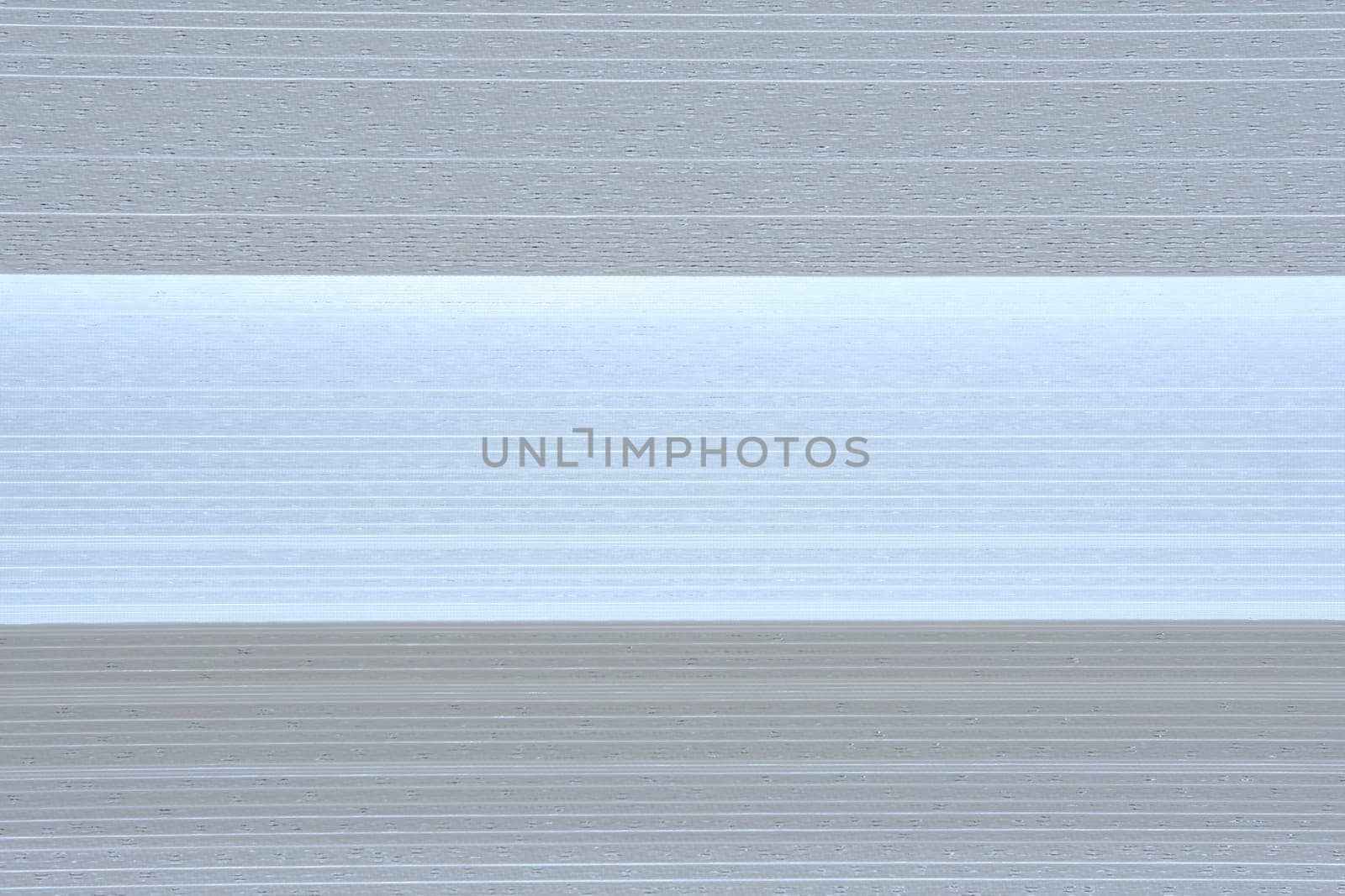 Strips of fabric with different shades of white color.