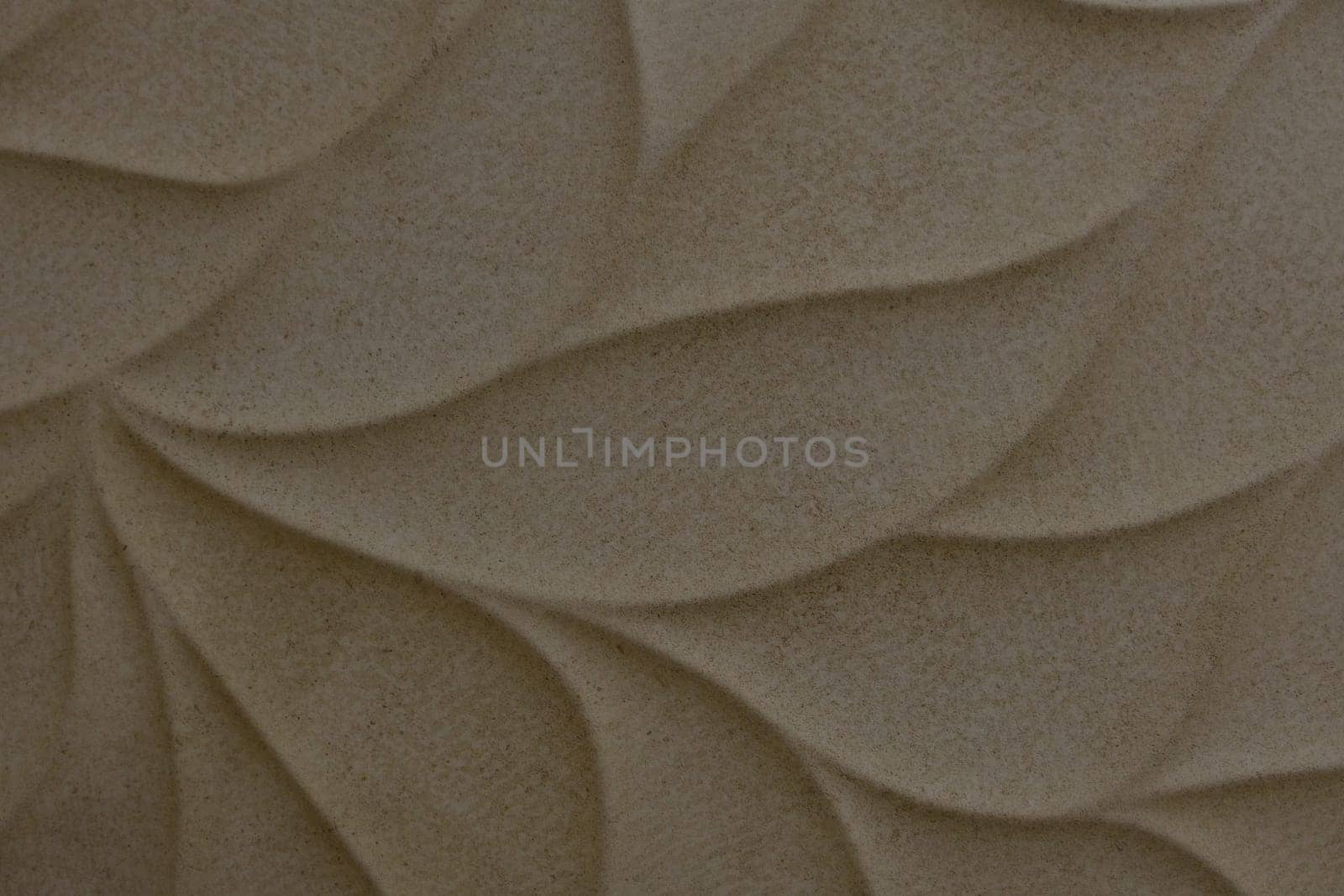Beige ceramic tile with leaves pattern for wall and floor decoration. Concrete stone surface background. Texture for interior design project