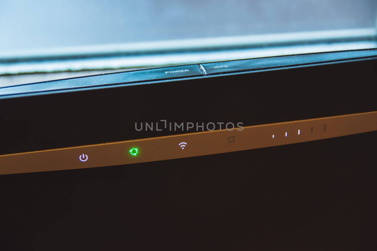 Home internet wifi router and backlit indicators, closeup