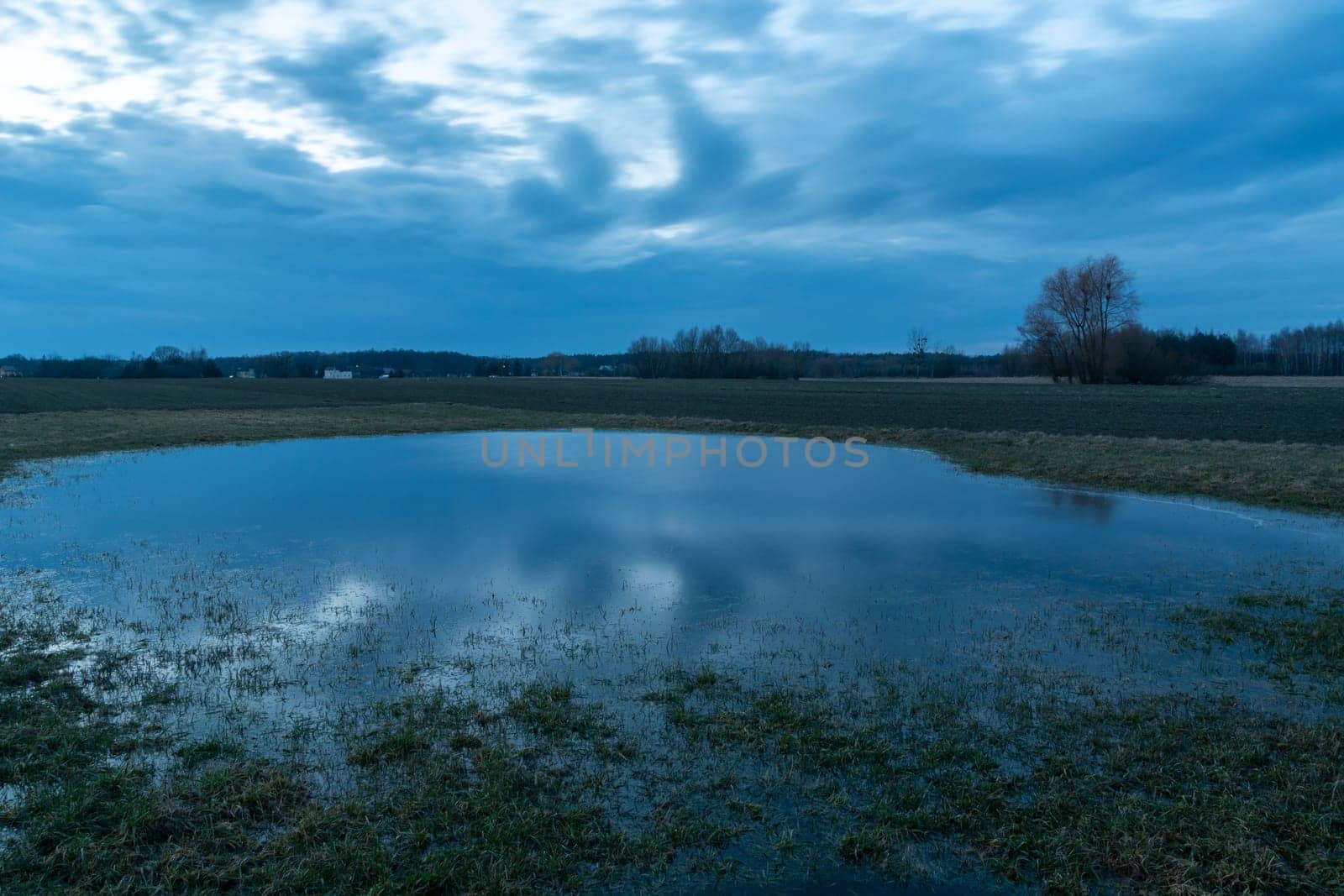 Water in the meadow and the cloudy sky, Nowiny, Poland