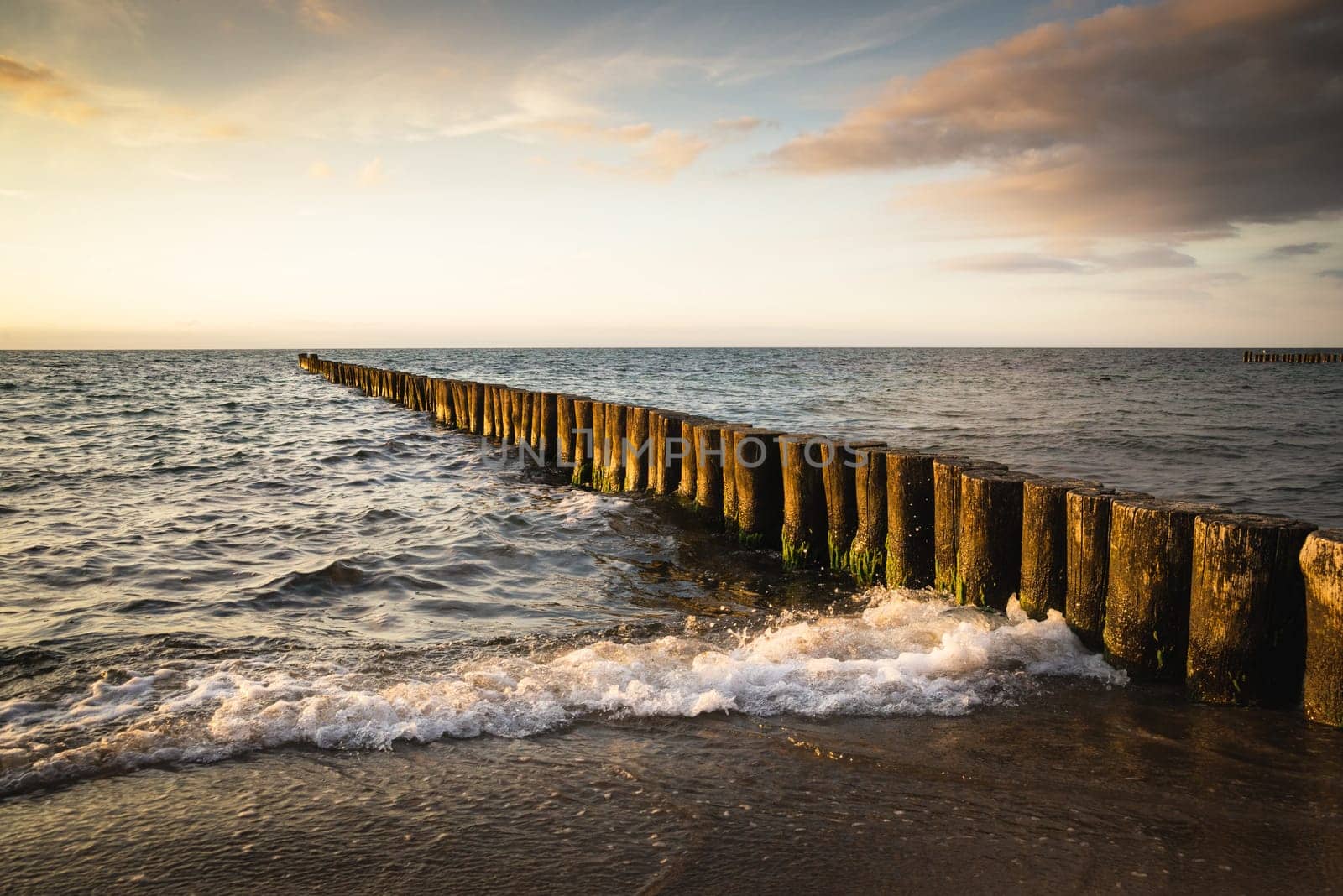 wooden breakwater in sea