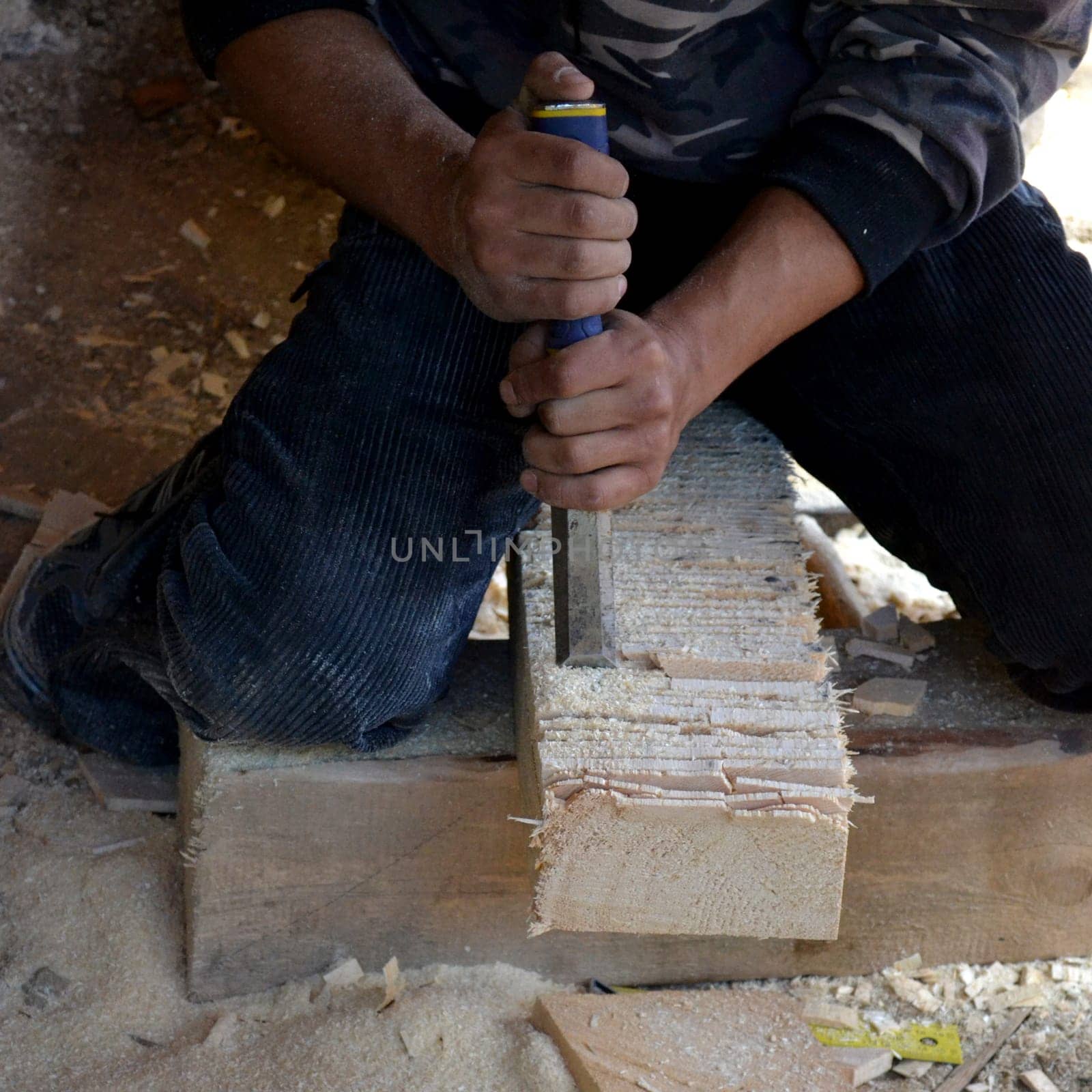 Carpenter working with a chisel