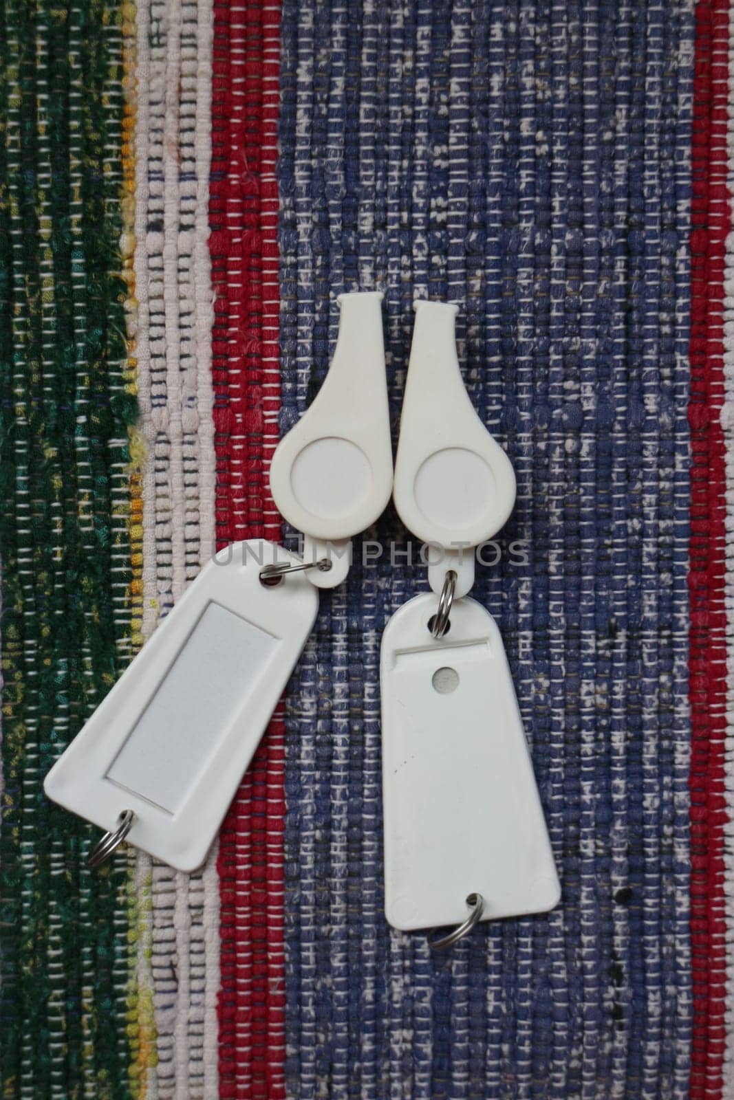 pair of white whistles on a colorful background flat lay