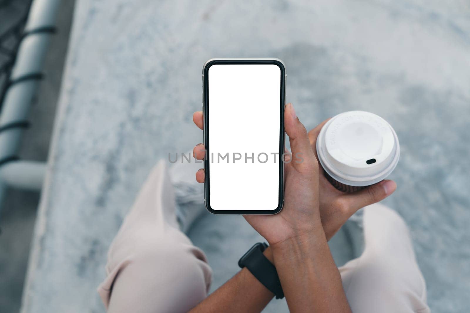 close-up phone on hand holding above view angle