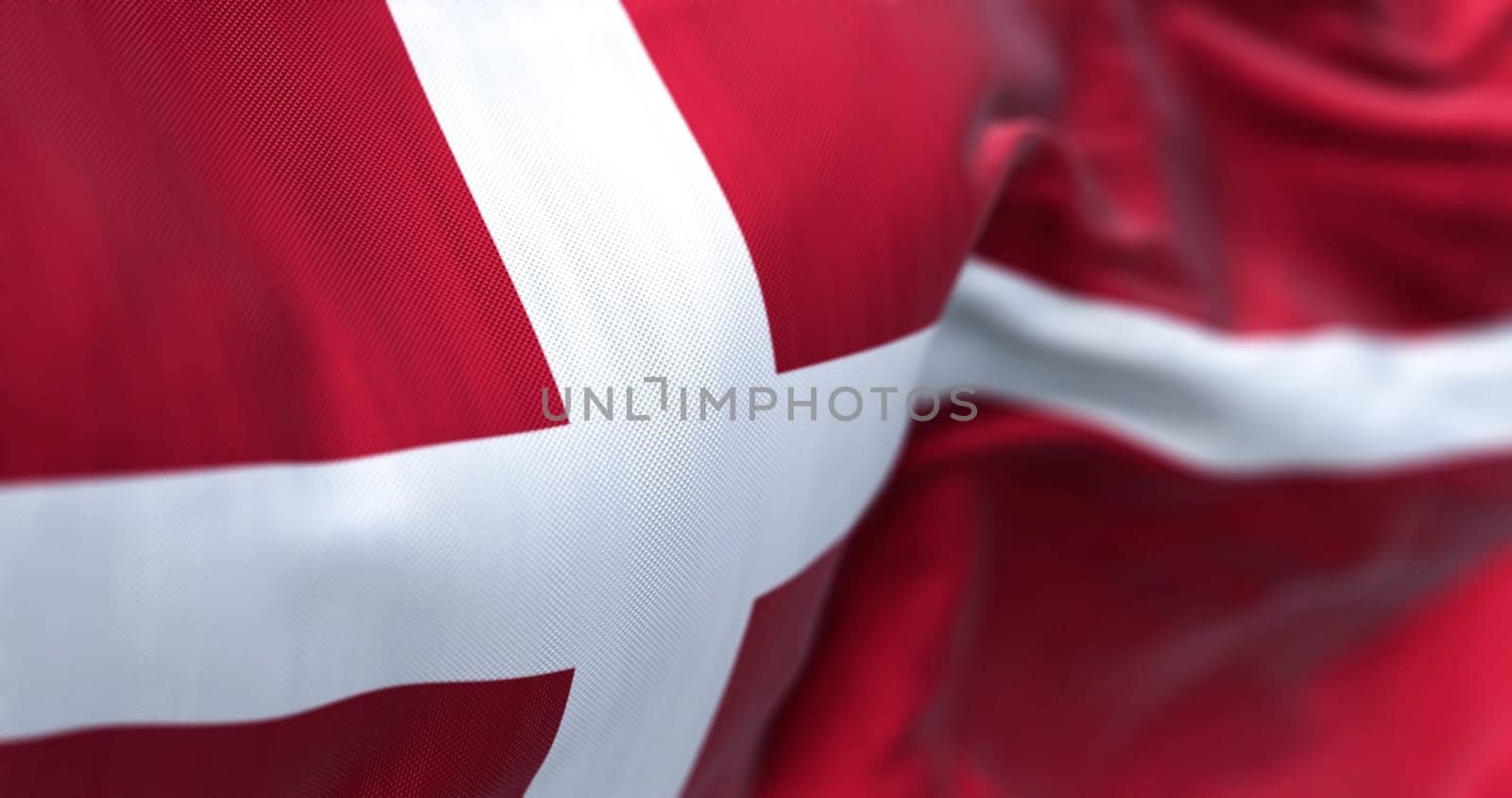 Close-up view of Denmark national flag waving in the wind. Scandinavian country located in northern Europe