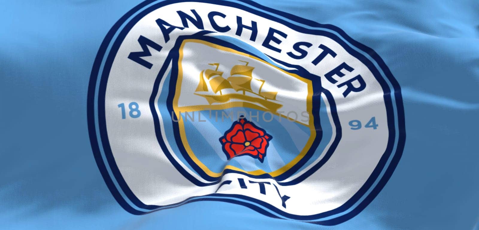 Manchester, UK, May 2022: Fabric background with the Manchester City Flag waving. Manchester F.C. is a professional football club based in Bradford, Manchester