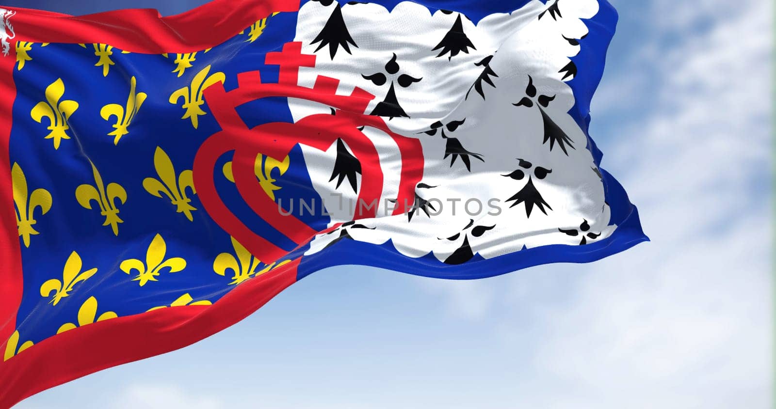 The flag of Pays de la Loire French region waving in the wind on a clear day. Pays de la Loire is one of the 18 regions of France, in the west of the mainland. French administrative region